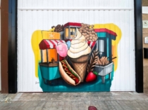 Graffiti de comida pintado en puerta metalica