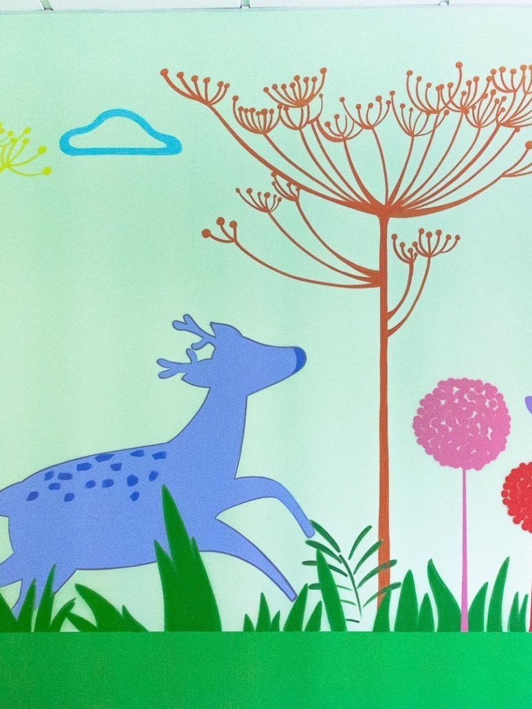 Hand-painted children's mural in a nursery