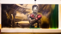 Mural de boxeador mexicano pintado sobre pared de restaurante